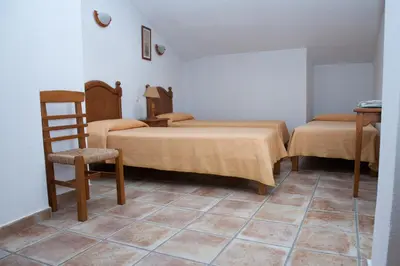 Cama o camas de una habitación en Hostal El Rincón