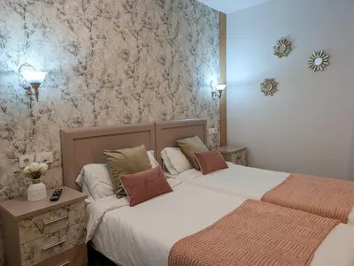 Cama o camas de una habitación en Apartamentos Arcos