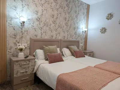 Cama o camas de una habitación en Apartamentos Arcos