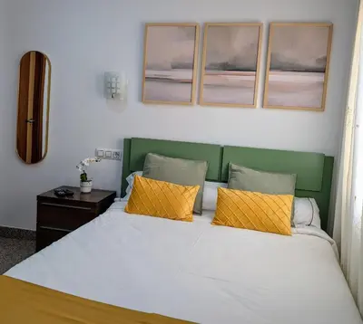 Cama o camas de una habitación en Apartamentos Arcos