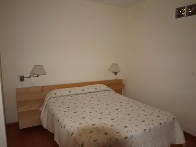 Cama o camas de una habitación en Apartamentos Turísticos La Peña