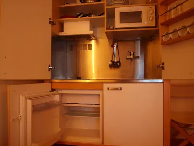 Una cocina o zona de cocina en Apartamentos Turísticos La Peña