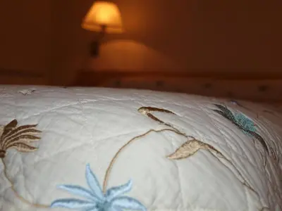 Cama o camas de una habitación en Apartamentos Turísticos La Peña