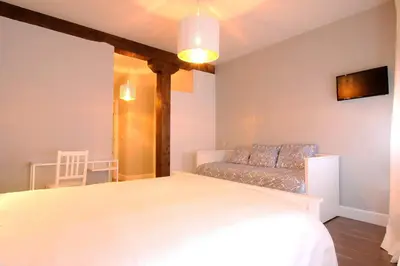 Cama o camas de una habitación en La Fonda de Candeleda