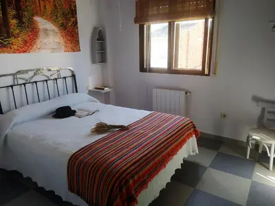 Cama o camas de una habitación en Apartamento Turístico La Ribera