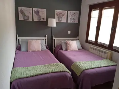 Cama o camas de una habitación en La Casa De Marta