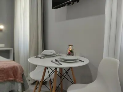 Una televisión o centro de entretenimiento en Apartamentos Harmonía