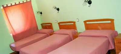 Cama o camas de una habitación en Albergue Aurora Boreal