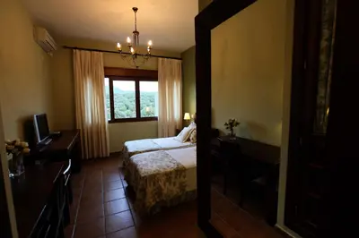 Cama o camas de una habitación en La Senda de los Enebros