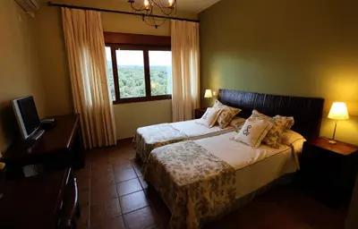 Cama o camas de una habitación en La Senda de los Enebros