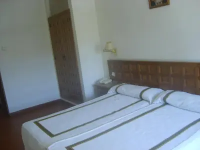 Cama o camas de una habitación en Hotel Hispanidad