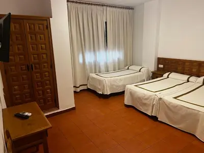 Cama o camas de una habitación en Hotel Hispanidad