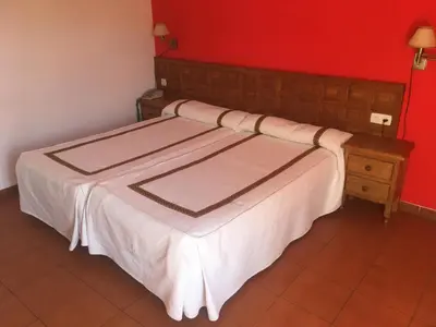Cama o camas de una habitación en Hotel Hispanidad