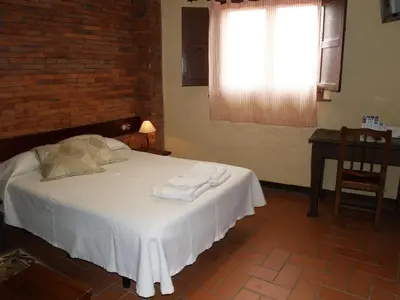 Cama o camas de una habitación en Hotel Rural El Rocal