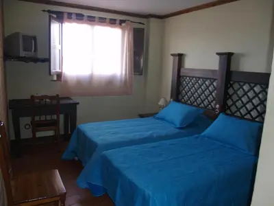 Cama o camas de una habitación en Hotel Rural El Rocal