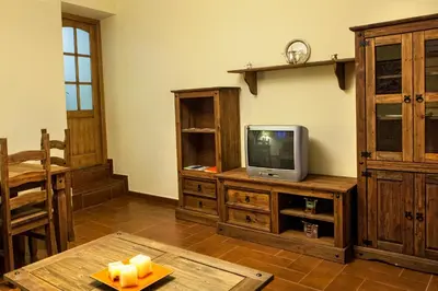 Una televisión o centro de entretenimiento en Apartamentos Rurales La Casa de Luis