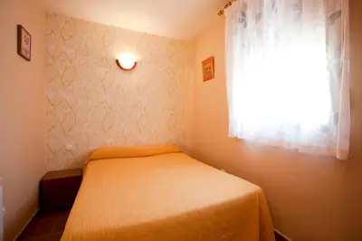 Cama o camas de una habitación en Apartamentos Rurales 