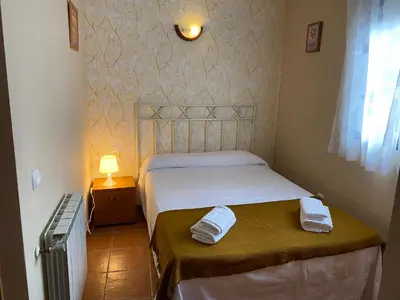 Cama o camas de una habitación en Apartamentos Rurales 