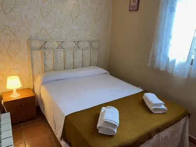 Cama o camas de una habitación en Apartamentos Rurales 