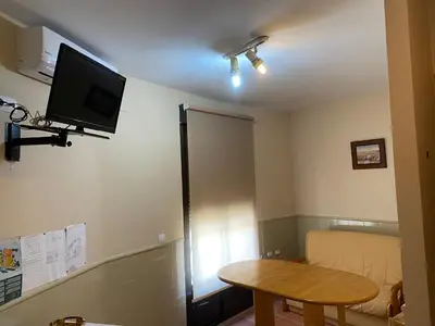 Una televisión o centro de entretenimiento en Apartamentos Rurales 