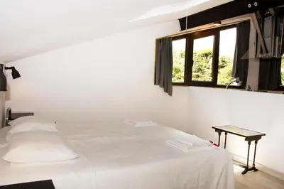 Cama o camas de una habitación en Apartamentos Puenteviejo