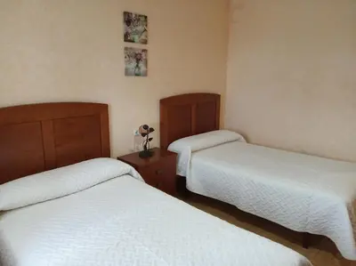 Cama o camas de una habitación en La Fuente de la Covatilla