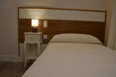 Cama o camas de una habitación en Hotel Español