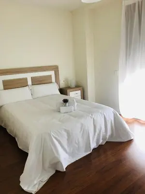 Cama o camas de una habitación en Apartamento turisticos Puente Romano P3 2-B