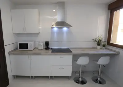 Una cocina o zona de cocina en Apartamento turisticos Puente Romano P3 2-A