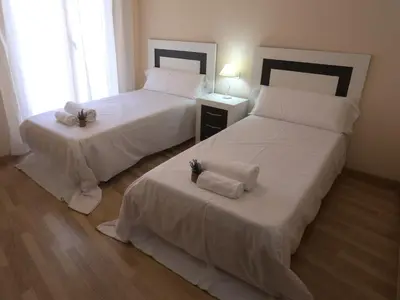Cama o camas de una habitación en Apartamento turisticos Puente Romano P3 2-A
