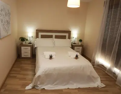 Cama o camas de una habitación en Apartamento turisticos Puente Romano P3 1-B
