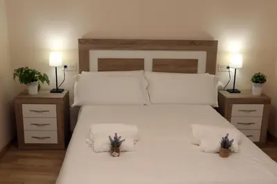 Cama o camas de una habitación en Apartamento turisticos Puente Romano P3 1-B