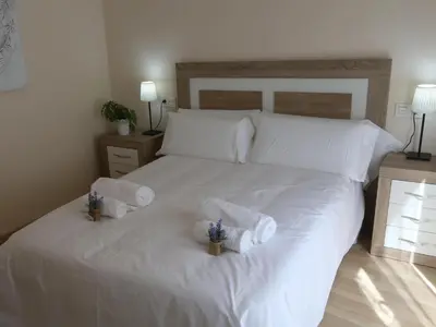 Cama o camas de una habitación en Apartamento turisticos Puente Romano P3 1-A