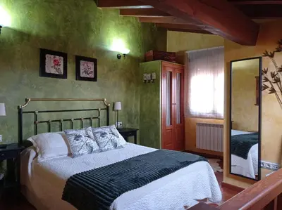 Cama o camas de una habitación en casa rural EL RINCON