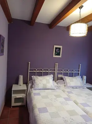Cama o camas de una habitación en casa rural EL RINCON