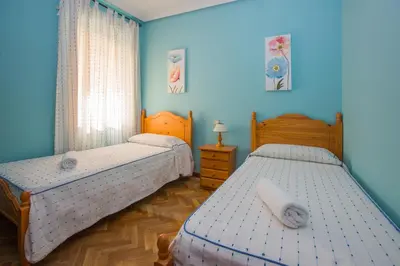 Cama o camas de una habitación en Apartamentos Turisticos Avila Villa Carmen II