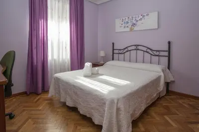 Cama o camas de una habitación en Apartamentos Turisticos Avila Villa Carmen II