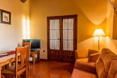 Una televisión o centro de entretenimiento en Casa Rural Caseta de los Camineros