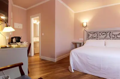 Cama o camas de una habitación en Hostal Los Castañuelos