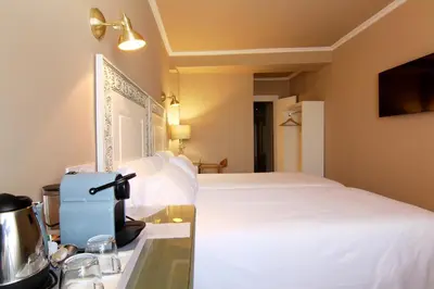 Cama o camas de una habitación en Hostal Los Castañuelos