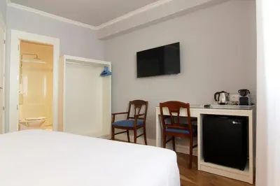 Cama o camas de una habitación en Hostal Los Castañuelos