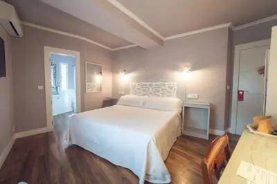 Cama o camas de una habitación en Hostal Los Castañuelos