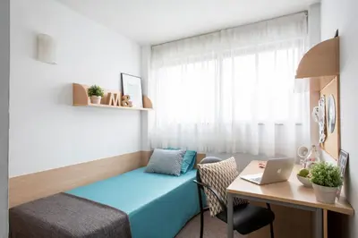 Cama o camas de una habitación en Residencia Universitaria Resa Colegio de Cuenca
