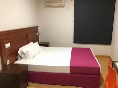 Cama o camas de una habitación en KubiK HOTEL