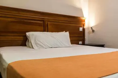 Cama o camas de una habitación en KubiK HOTEL