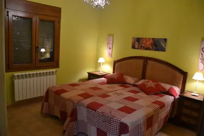 Cama o camas de una habitación en Apartamentos Rurales Natura