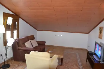 Una televisión o centro de entretenimiento en Apartamentos Rurales Natura