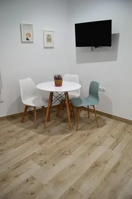 Una televisión o centro de entretenimiento en Nova Domus Apartamentos