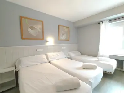 Cama o camas de una habitación en Hostal Albero by gaiarooms