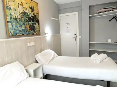 Cama o camas de una habitación en Hostal Albero by gaiarooms